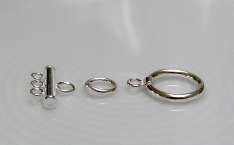 jump ring between clasp and multi-strand end bar